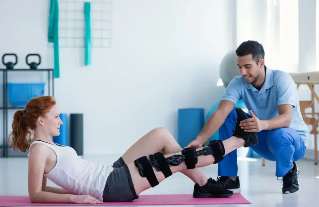 Woman having treatment to help muscle recovery Harefield after an injury
