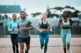 Sculpting Sleek Arms: The Essential Role of Cardio in Toning Without Bulking Up 3 image of people running to incorporate cardio Harefield exercise into their life to help tone arms and body.