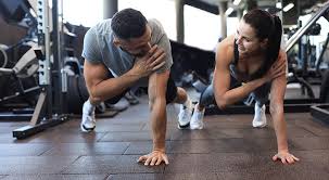 Sculpting Sleek Arms: The Essential Role of Cardio in Toning Without Bulking Up 1 Image of man and woman doing Cardio Harefield to tone their arms.